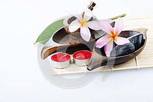 Frangipani flower with candle. Spa & aromatherapy concept.