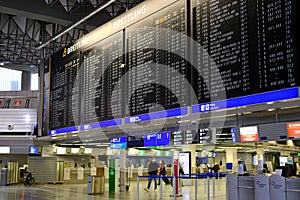 Frankfurt, Germany - January 2022: black scoreboard, schedule of aircraft flights on electronic scoreboard, travelling covid-19