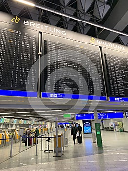 Frankfurt, Germany - January 2022: black scoreboard, schedule of aircraft flights on electronic scoreboard, travelling covid-19