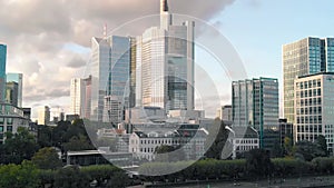 Frankfurt, Germany - September 10, 2019: Panoramic sunset view of city financial skyline from above the Main river