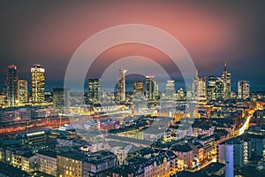 Frankfurt am Main from above, cityscape with the skyline in the evening. Illuminated streets and buildings at night