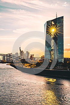 Frankfurt am Main, view across the river over the European Central Bank. ECB, in the background with the skyline and a sunset