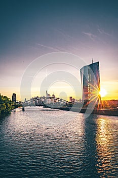 Frankfurt am Main, view across the river over the European Central Bank. ECB, in the background with the skyline and a sunset