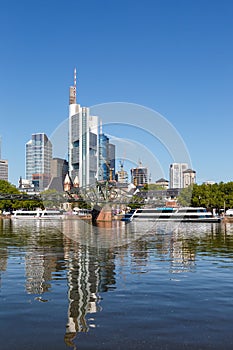Frankfurt skyline with Main river and Eiserner Steg Bridge travel traveling portrait format in Germany photo