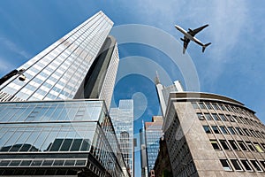 Frankfurt skyscrapers buildings and a plane flying overhead in m