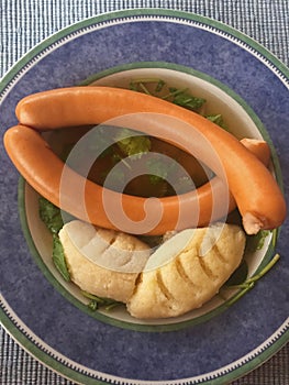 Frankfurter sausages and homemade Semolina dumplings in soup