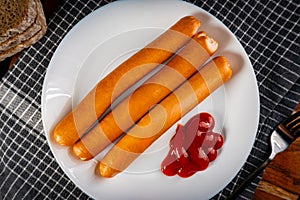 Frankfurter sausages with ketchup