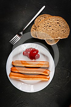 Frankfurter sausages with ketchup