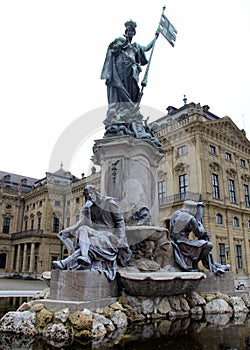 Frankonianbrunnen, sculptures decorated neo-baroque fountain, in front of the Archbishopric Palace, Wurzburg, Germany photo