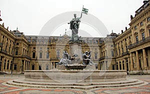 Frankonianbrunnen, sculptures decorated neo-baroque fountain, in front of the Archbishopric Palace, Wurzburg, Germany photo