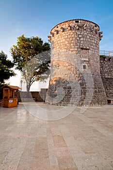 Frankopan fortress tower marble pavement and little wooden shop