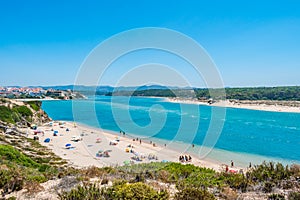Franquia beach in Milfontes with river Mira and village in the background, Odemira PORTUGAL photo