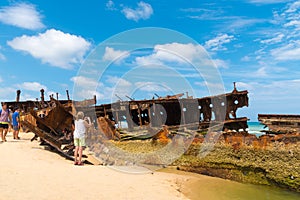 People at the Maheno shipwreck on 75 mile beach, one of the most popular landmarks on Fraser Island, Fraser Coast, Queensland, Aus