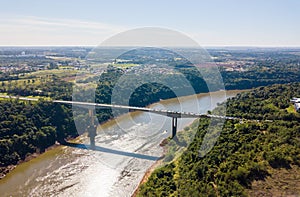 Fraternity Bridge bridge and border crossing over the Iguassu River and the town of Puerto Iguazu. Argentina, Brazil.