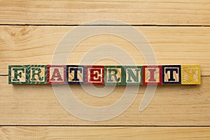 Fraternity wood cube words on wooden table cool