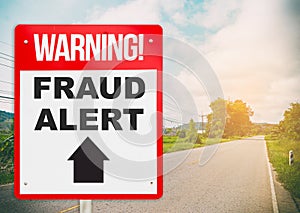 Fraud Alert ahead warning signage on the road