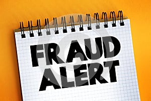 Fraud Alert text on notepad, concept background