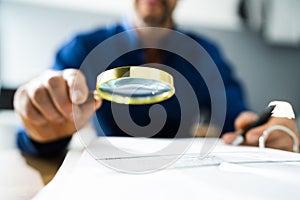 Fraud Detective Using Magnifying Glass