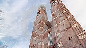 Frauenkirche Church exterior of building in Old Town Square in Munich looking up perspective timelapse. Germany