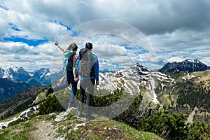 Frauenkogel - Couple backpacker hiking with view on the mountain peaks in the Karawanks in Carinthia. Freedom photo