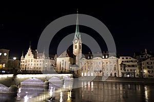 Fraumunster church at night reflected in the river