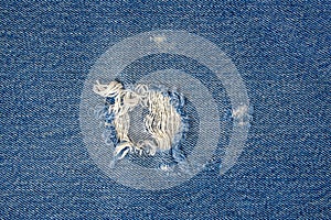 Frayed blue jean fabric