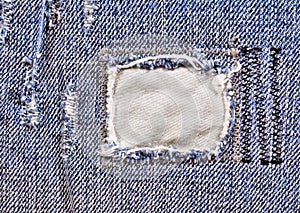 Frayed blue jeans closeup