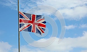 Frayed English flag at half mast