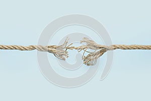 Frayed rope on color background