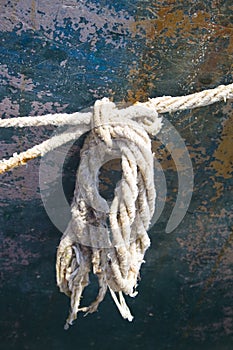 Frayed rope on side of boat