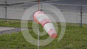 Frayed windsock in moderate wind on the airfield