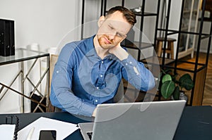Frazzle guy using laptop for remote working, a guy tired and burnout