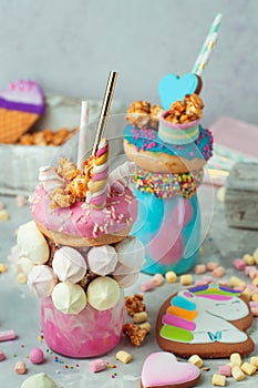Freak shakes topping with donut, marshmallow decorated as unicorn
