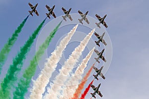 Frecce Tricolori: italian aerobatic Team performing alona , low pass with italian flag colors smokes