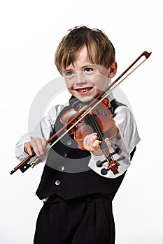 Freckled red-hair boy playing violin.