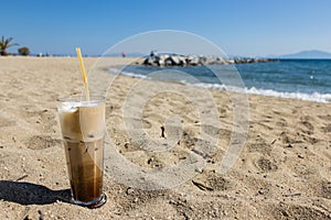 Freddo cappuccino on the beach.