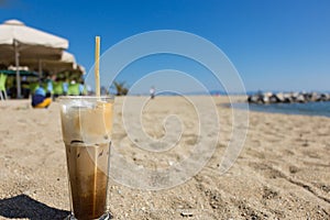 Freddo cappuccino on the beach.