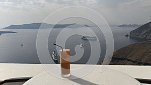 Freddo Espresso on transparent glass in Santorini, Greece. photo