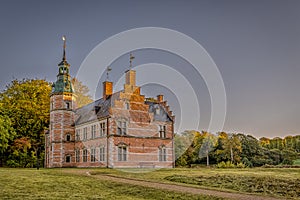 Frederiksborg Bath House Castle on a green lawn photo