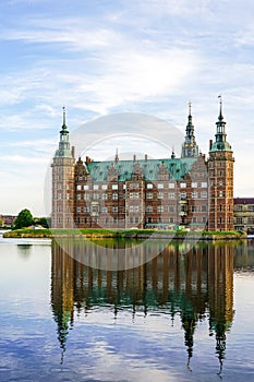 Frederiksborg castle in Hillerod, lakeside facade, beautiful facade reflection in lake water