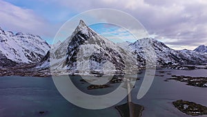 Fredvang Bridge and Volandstind Mountain in Winter. Lofoten, Norway. Aerial View