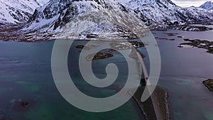 Fredvang Bridge and Volandstind Mountain in Winter. Lofoten, Norway. Aerial View