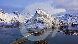 Fredvang Bridge and Volandstind Mountain in Winter. Lofoten, Norway. Aerial View