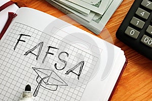 Free Appication for Federal Student Aid FAFSA is shown on the photo using the text