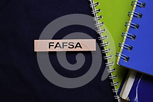 Free Application For Federal Student Aid FAFSA on sticky Notes isolated on office desk