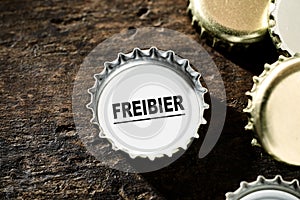 free beer concept with bottle tops photo