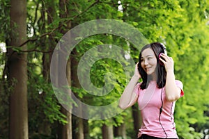 Free careless causual beauty girl woman enjoy relax time in nature spring summer listening to music