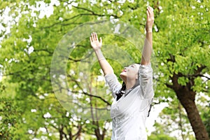 Free careless causual beauty girl woman hug nature enjoy relax time in forest summer park