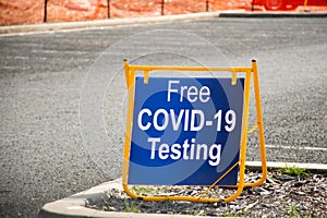 Free COVID-19 testing. Drive through testing clinic sign on a road