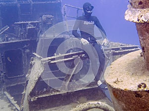 A free diver sitting on a ship wreck in Malta